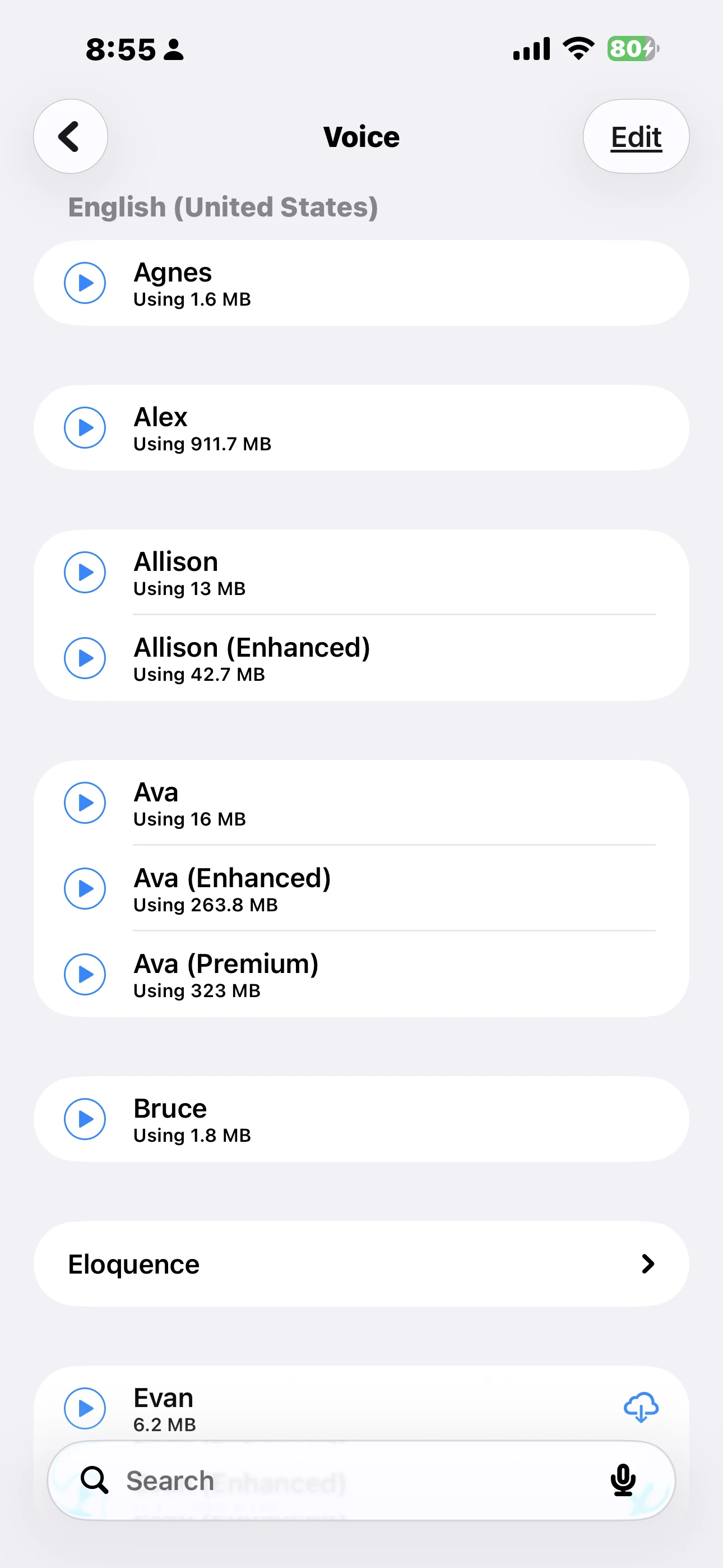 The iOS Settings voice list. Each voice shows its size, and one entry has a cloud download button on the right
